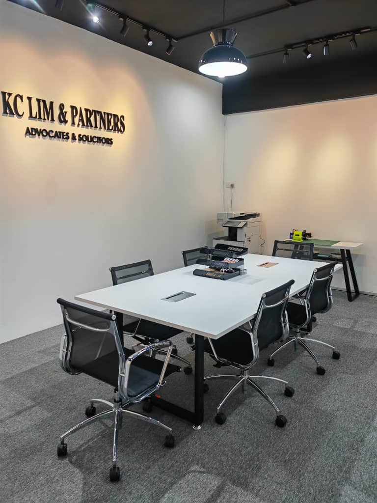 Two lawyers from KC LIM & Partners discussing a case